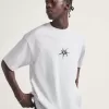 Camiseta con salpicaduras de skate